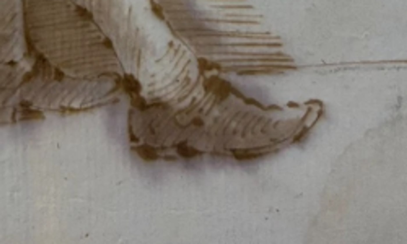 Earlier, lower-magnification view of the extended foot: heeled shoe with a compact instep cluster and the second shoe in profile beneath the bench.